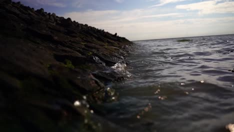 waves-are-slowly-beating-on-the-fortified-stone-coast-in-the-north-of-the-state-in-germany