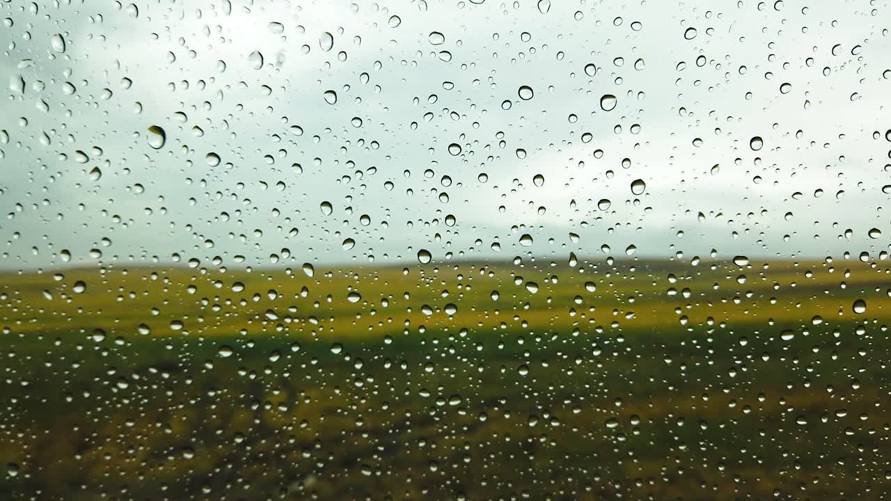 Slow Motion:Rain drop on the car glass