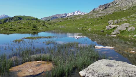 Scenic-Peaceful-Mountain-Lake-Lac-Guichard-in-French-Alps---Aerial