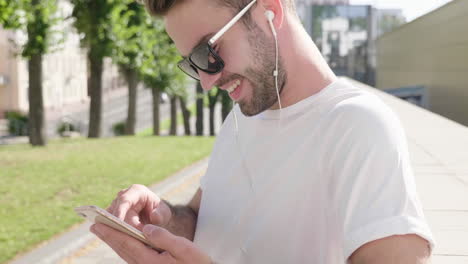 man using phone outdoors