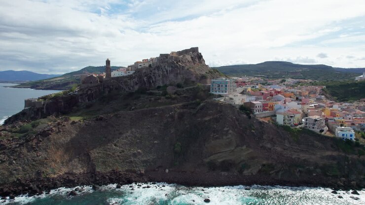 city of Castelsardo, Sardinia: aerial view in orbit over this impressive city on the island of Sardinia