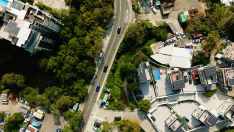 Drone-top-shot-of-busy-highways-and-tall-buildings-in-Hongkong,-China