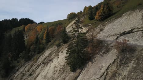 rural and dangerous road along mountain rocky slope, plateau des glières in haute-savoie, france