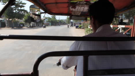 pov shot from a pedicab traveling through the streets of myanmar burma