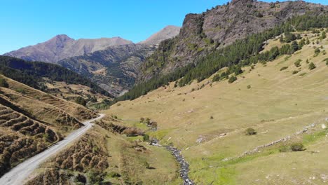 aerial: valley with a small river in the pyrenees