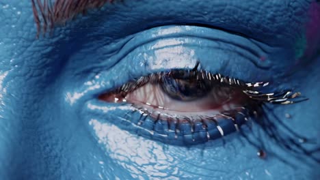 close-up of artistic blue eye makeup