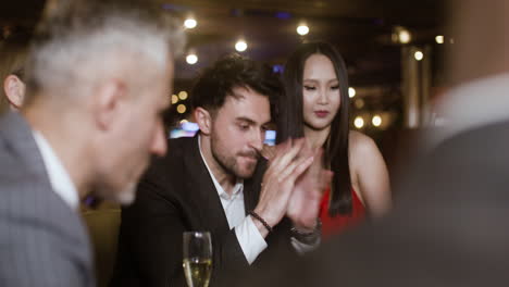 people playing poker at the casino.