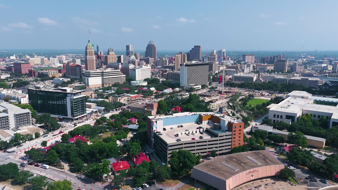 Landscape drone shot of the city of San Antonio downtown that includes the famous Hemisfair Park, Tower of Life Building and the city's skyline from the South side of town