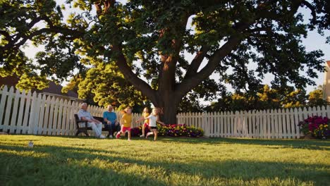 grandparents and grandkids playing in the backyard