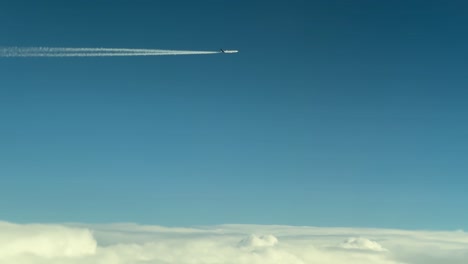 aircraft in blue sky, seen from another plane’s window