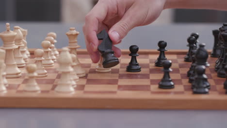 close of chess board while people are playing the game