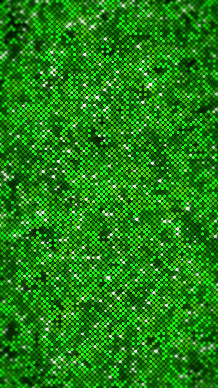 Green sequins disco background, glitters, sparkles, paillettes. Disco party with shiny sequined scales, dots. Metallic wall texture. Loop animation. Vertical video.