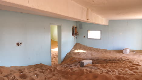 sand filled room, abandoned building, al madam village in sharjah desert