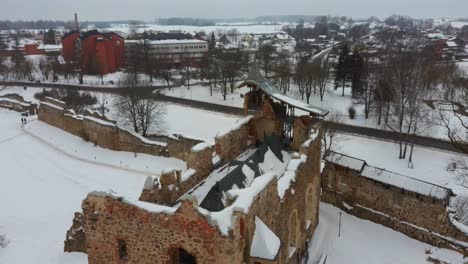 Ruins-of-Ancient-Livonian-Order's-Stone-Medieval-Castle-Latvia-Aerial-Drone-Top-Shot-From-Above