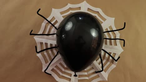 halloween decorations. black spider balloon and paper spiderweb