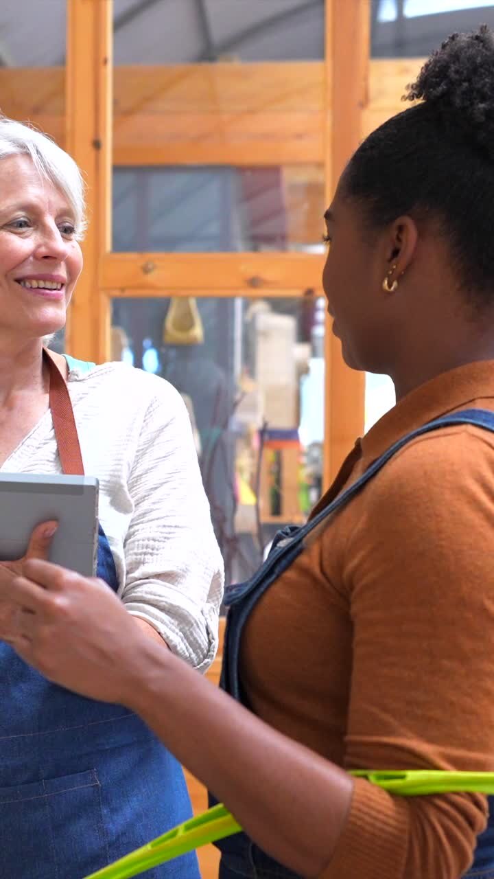Women in retail shop using a tablet