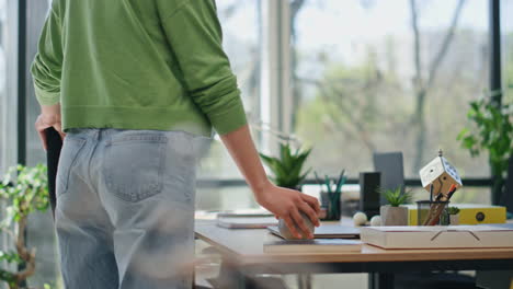 businesswoman bringing tea cup table workplace closeup. manager opening computer