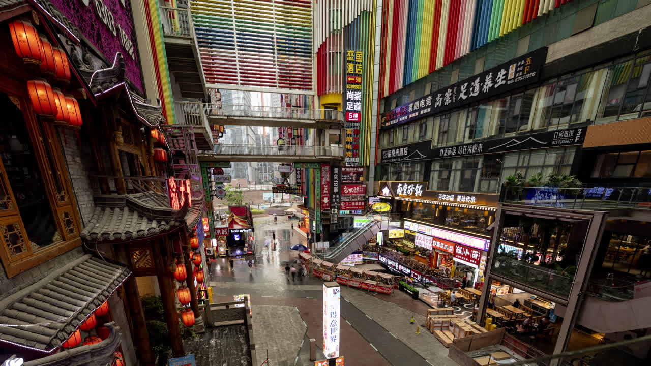 CHONGQING, CHINA - 28 MAY 2025 : Timelapse of the amazing Chongqing cyberpunk city neon street scene in the rain at night