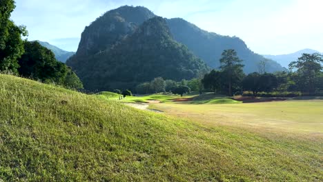 lush landscape with mountains and golf course