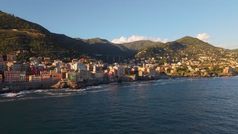 sunset over coastal cityscape with colorful buildings along the mediterranean coastline