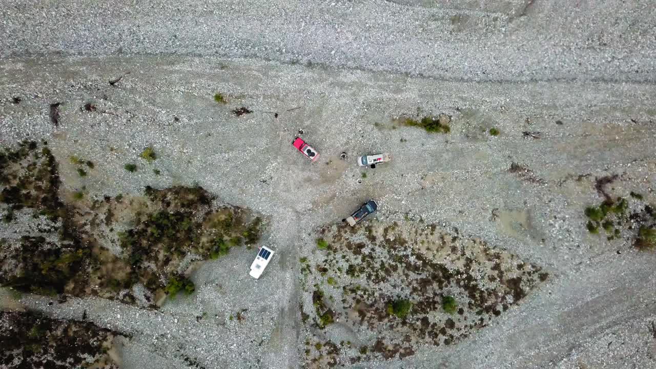 Off road vehicles parked by the side of the Dempster Highway in Northern Canada