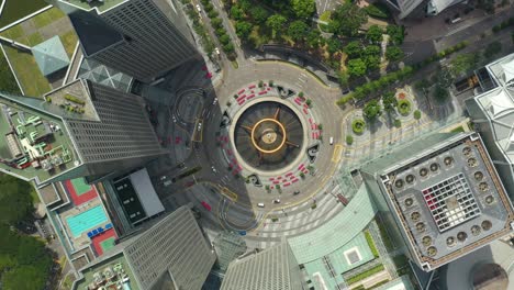 sunny day singapore city famous downtown buildings traffic circle square aerial panorama 4k