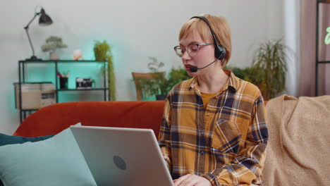 young woman freelance worker call center, support service operator helpline having talk with client