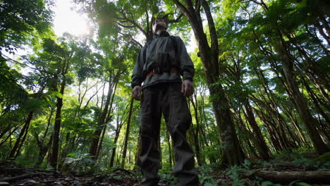 man hiking in a lush forest
