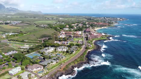 stunning aerial view capturing oceanfront resort hotels, beach, blue ocean and mountain landscape