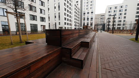 modern residential complex courtyard with wooden seating