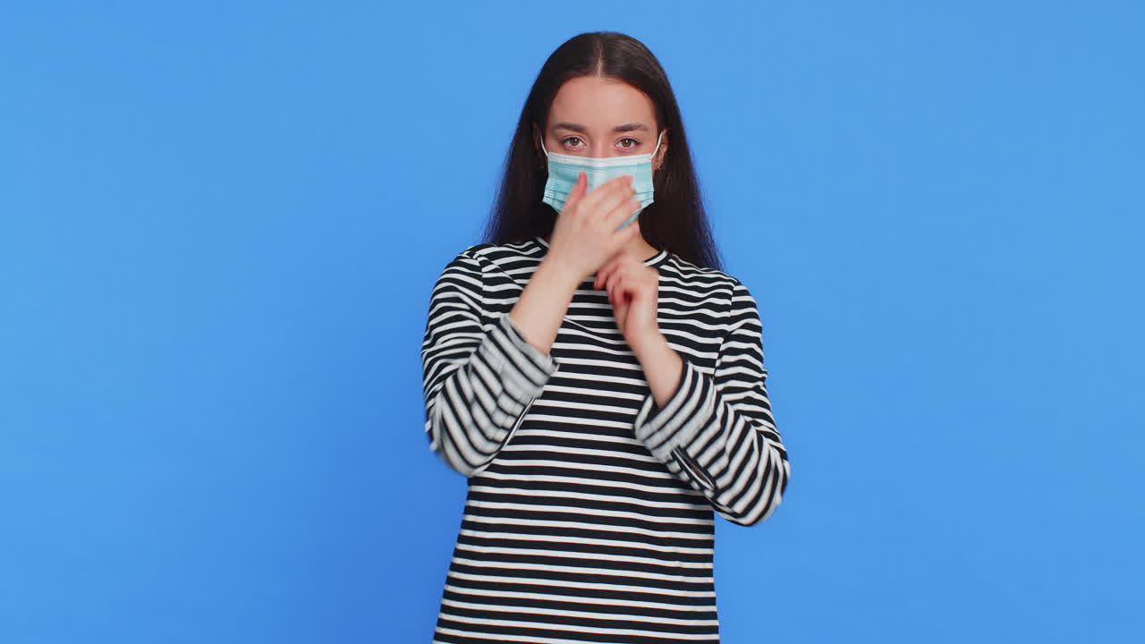 Sick ill caucasian woman wearing protective medical face mask flu virus allergy protection concept