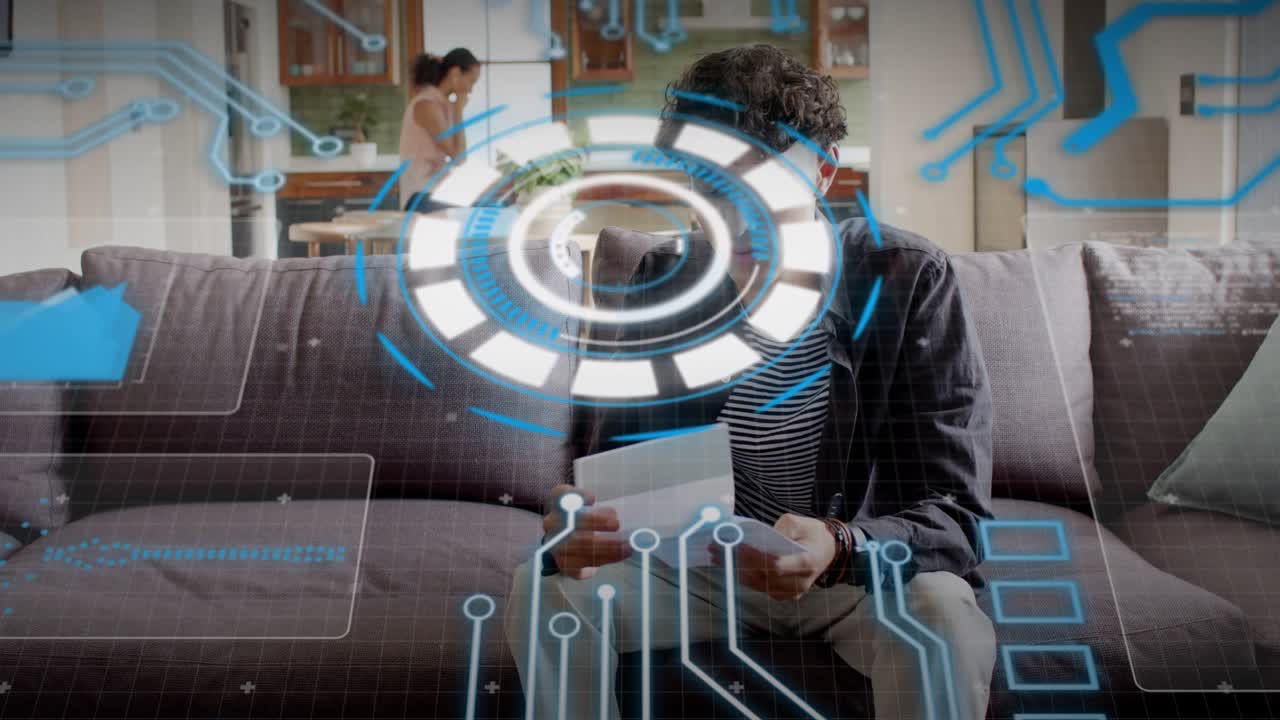 Man entering left and sitting on sofa, inspecting white tablet while HUD highlighting tech data