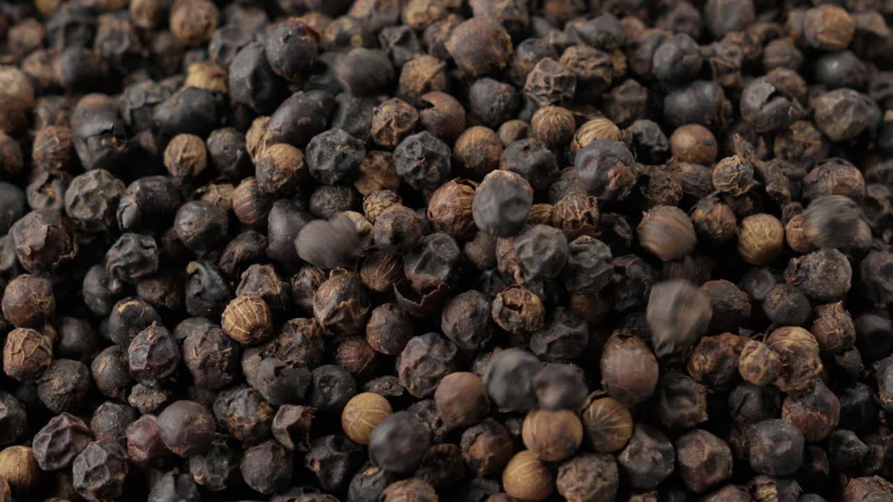Simple but captivating video shows dried black peppercorns falling