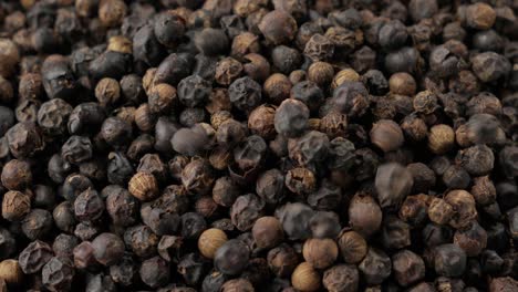 simple but captivating video shows dried black peppercorns falling