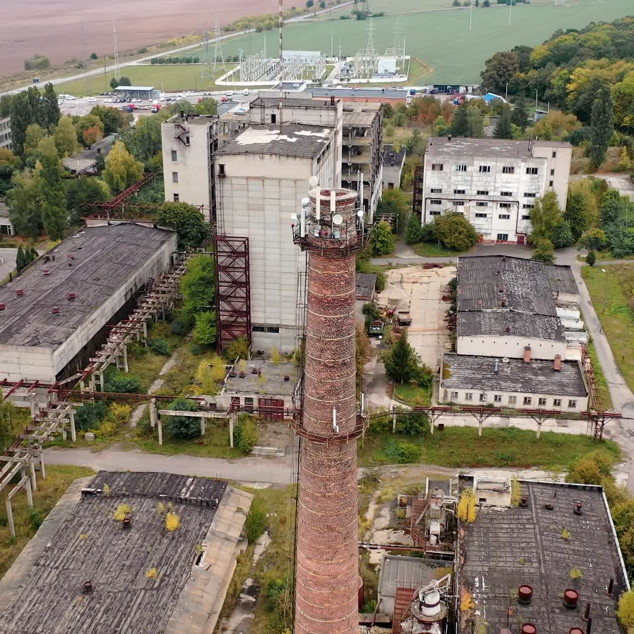 Damaged industry city buildings. Drone view of old ruined factory