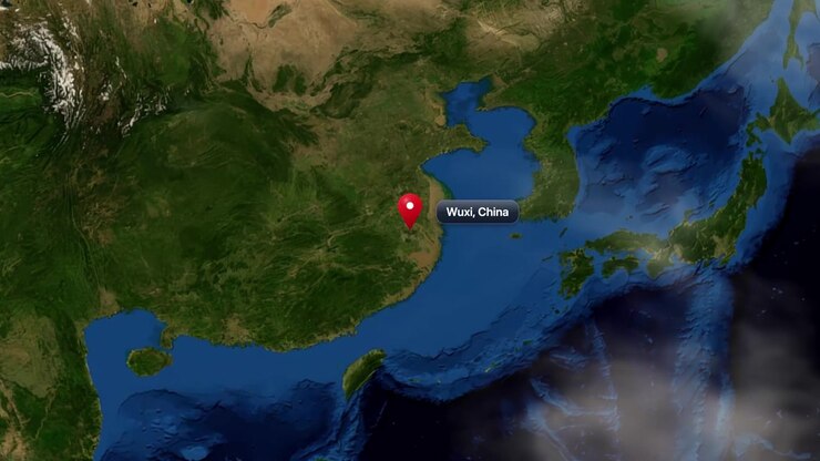 Satellite view zooming from deep space into planet Earth, pinpointing Wuxi City in China. Includes NASA public domain imagery.