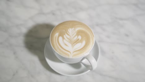 barista serving coffee- latte 60p