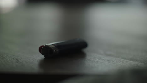 hand using a computer mouse on a dark wooden table