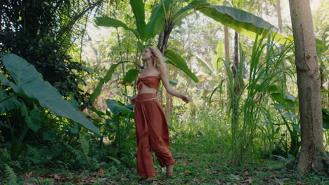 beautiful woman walking in forest dancing enjoying natural beauty exploring lush tropical jungle alone 4k