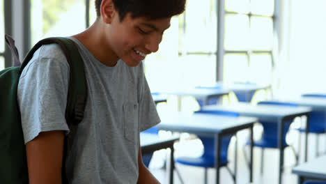 Schoolboy-using-mobile-phone-in-classroom