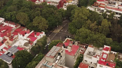 street traffic and red rooftops of mexico city suburbs, aerial view