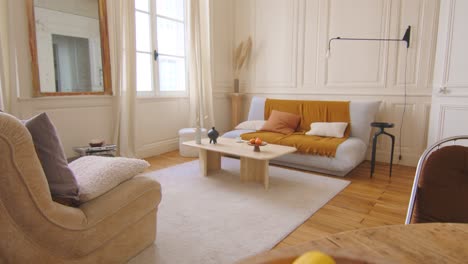 wide zoom in shot of a living room in french style