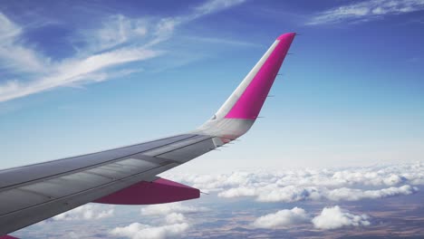 flying above clouds, wing view