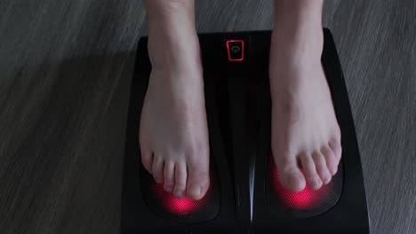 person using a foot massager