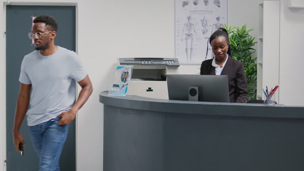 Male patient using mobile phone to pay with nfc on pos terminal