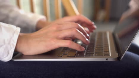 Closeup-shot-of-business-woman-working-on-laptop-at-home