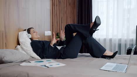 businesswoman relaxing in hotel room