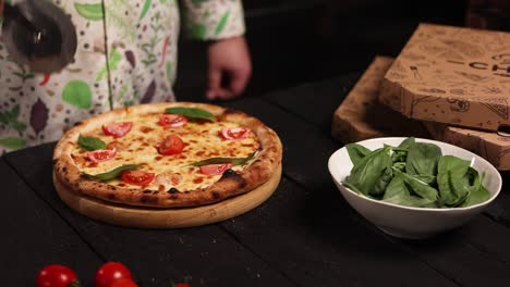 cutting a delicious homemade pizza