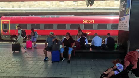 people seated and walking near a train