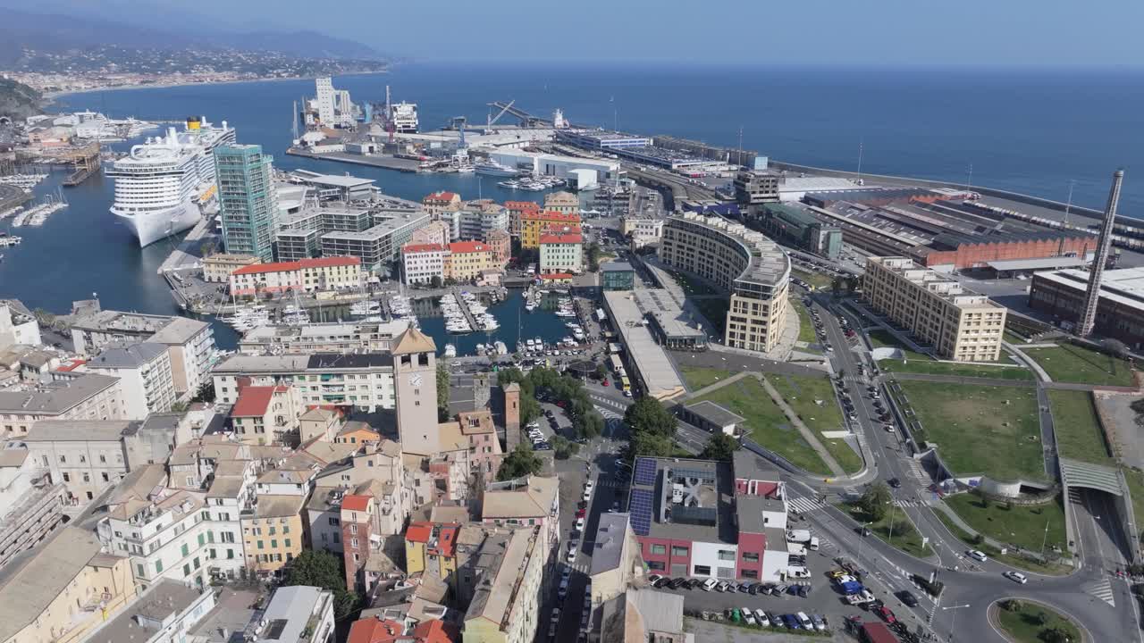 Savona city aerial view with harbor, ships, and urban surroundings on a sunny day